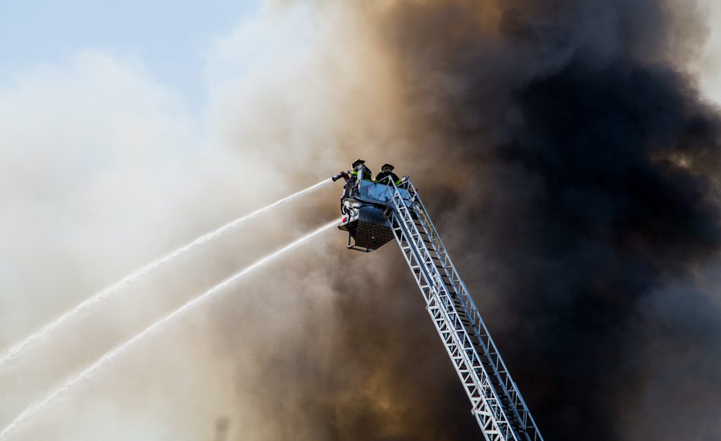 Firefighters attempting to put out massive fire